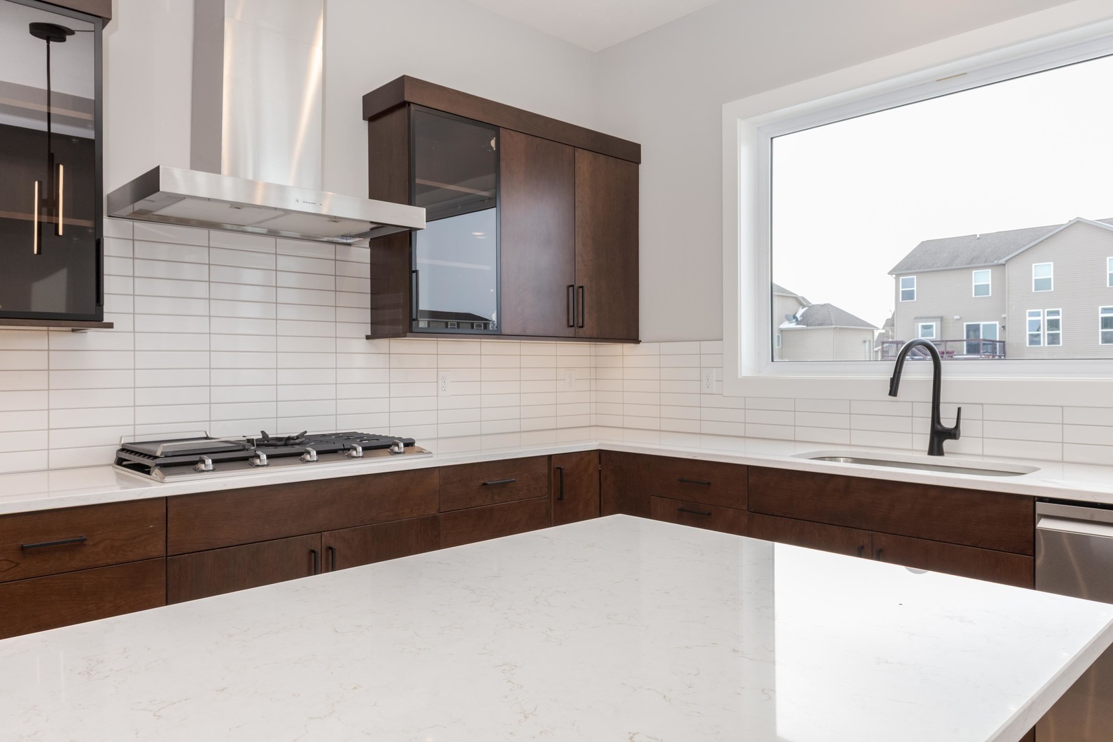 5303 Finlen Lane Bloomington, IL 61705 - Photo 19 of 58 a kitchen with a sink a stove and a microwave