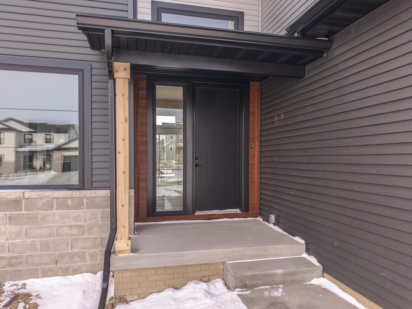 5303 Finlen Lane Bloomington, IL 61705 - Photo 3 of 58 a view of a brick house with a large windows
