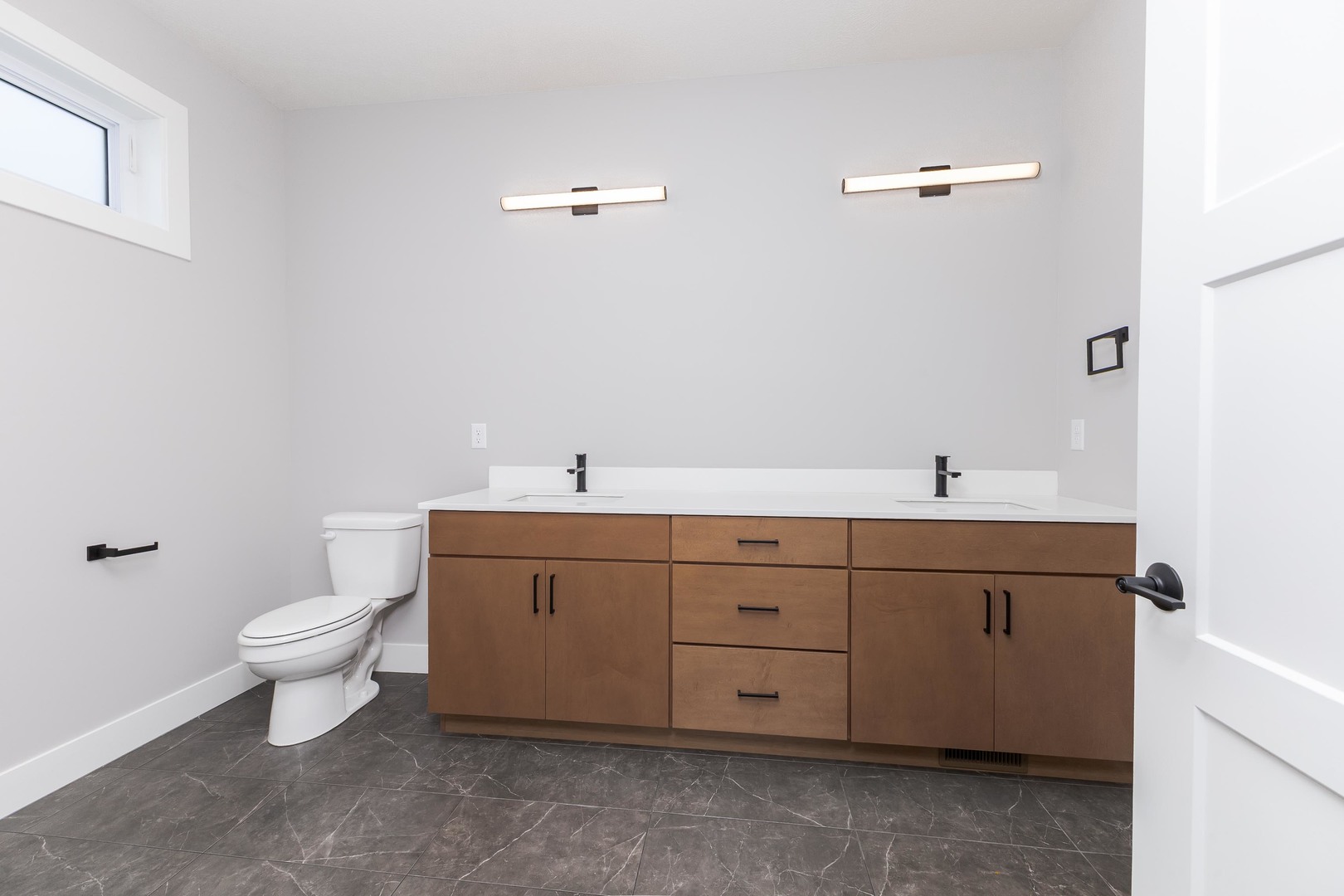 5303 Finlen Lane Bloomington, IL 61705 - Photo 32 of 58 a bathroom with a toilet sink and mirror