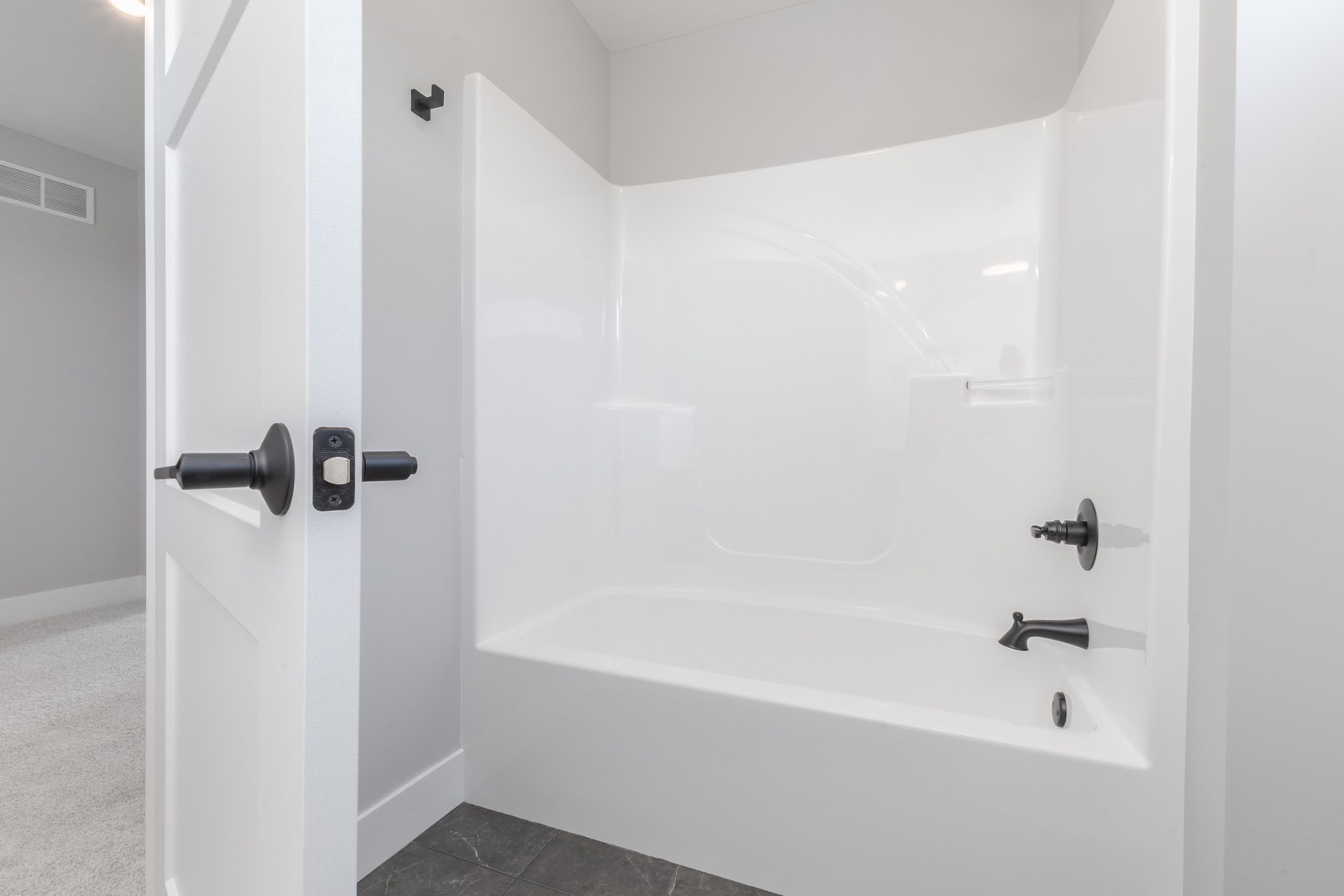 5303 Finlen Lane Bloomington, IL 61705 - Photo 38 of 58 a bathroom with a bathtub