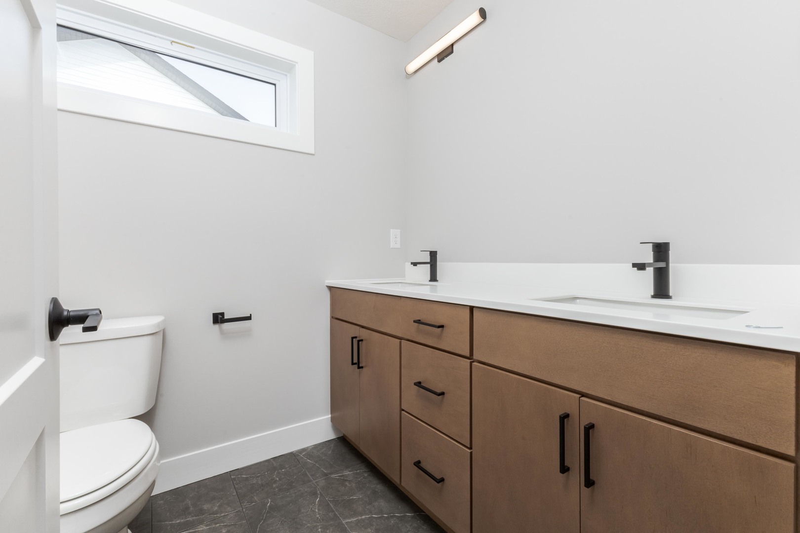 5303 Finlen Lane Bloomington, IL 61705 - Photo 39 of 58 a bathroom with a toilet sink and mirror