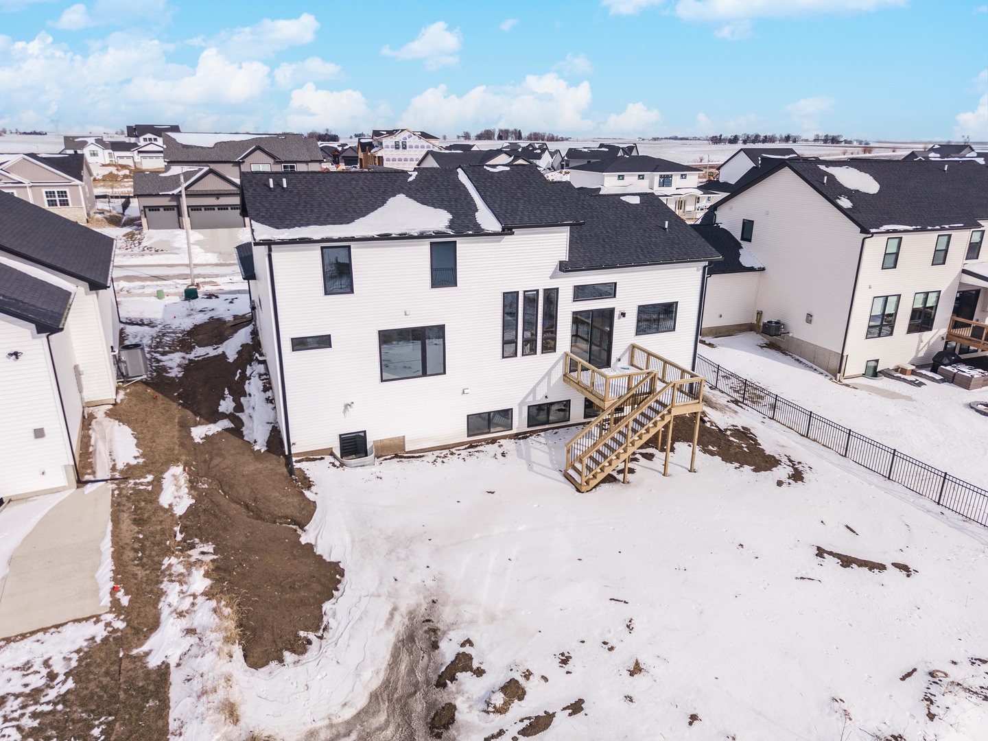 5303 Finlen Lane Bloomington, IL 61705 - Photo 54 of 58 a view of a house with a yard covered in snow