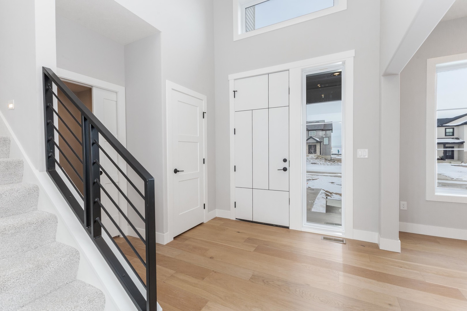 5303 Finlen Lane Bloomington, IL 61705 - Photo 7 of 58 a view of a livingroom with wooden floor and stairs