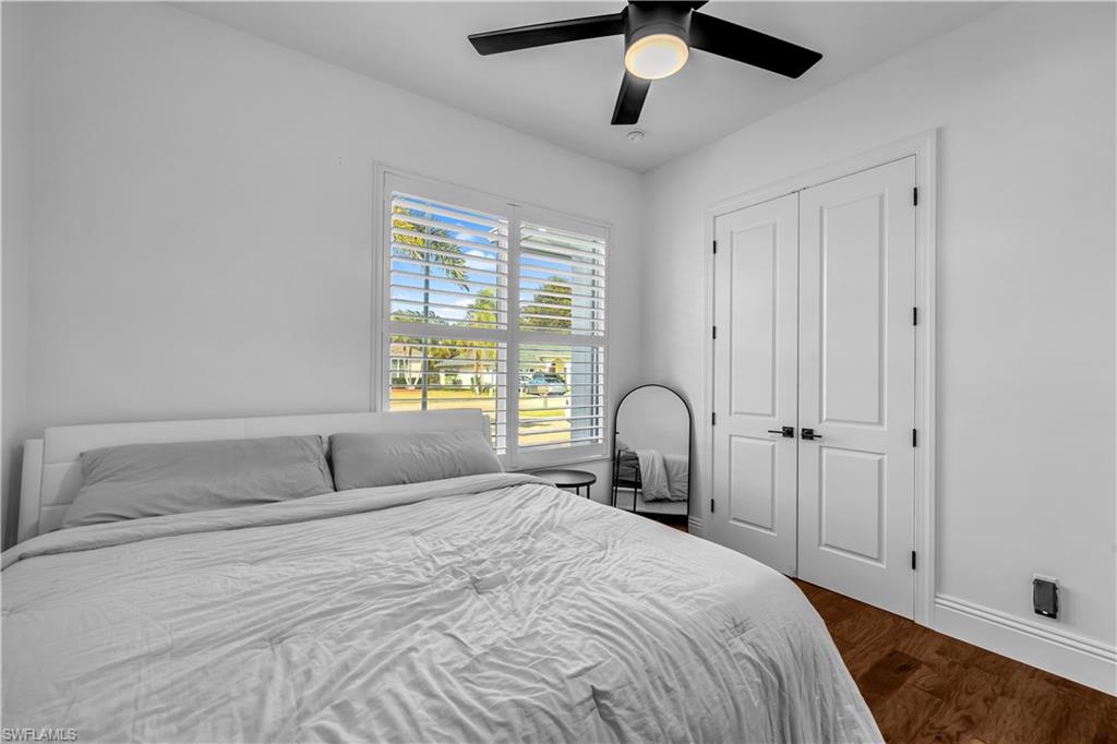 11141 Palmetto Ridge Drive Naples, FL 34110 - Photo 13 of 31 a bedroom with a bed and a window
