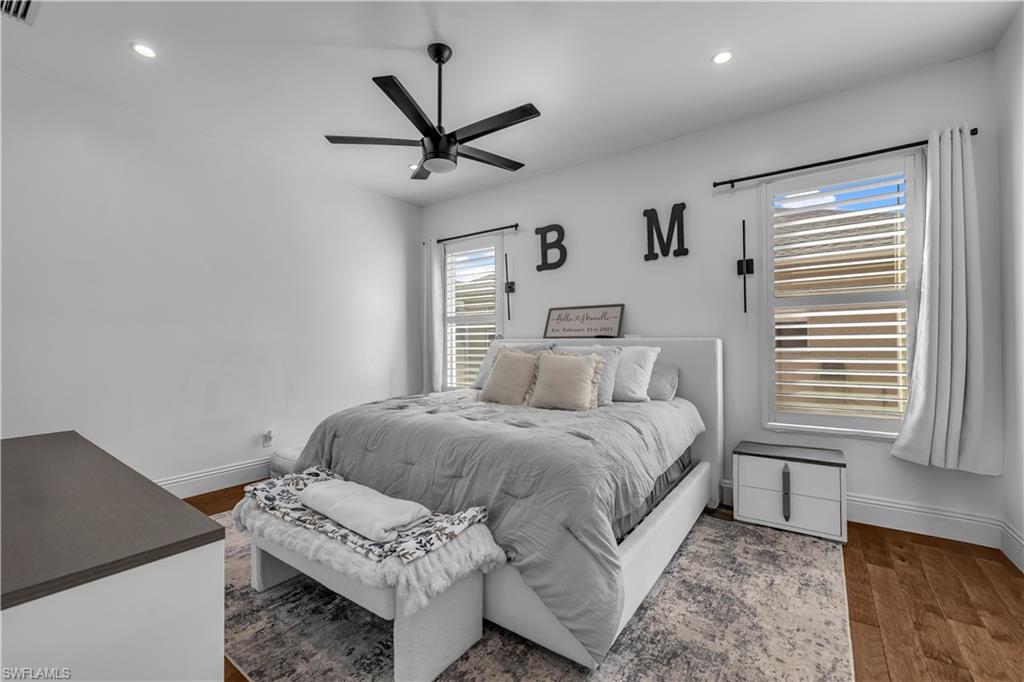 11141 Palmetto Ridge Drive Naples, FL 34110 - Photo 2 of 31 a living room with a bed furniture and a window