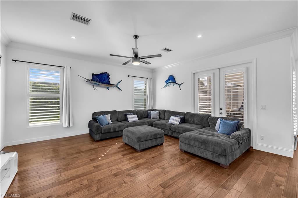 11141 Palmetto Ridge Drive Naples, FL 34110 - Photo 20 of 31 a living room with furniture and a window