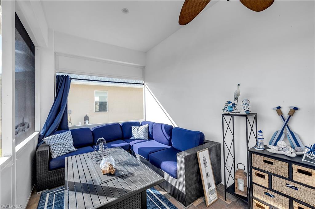 11141 Palmetto Ridge Drive Naples, FL 34110 - Photo 26 of 31 a living room with furniture