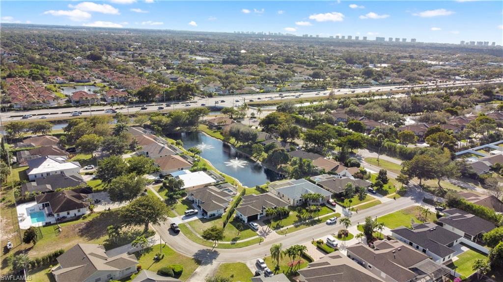 11141 Palmetto Ridge Drive Naples, FL 34110 - Photo 29 of 31 an aerial view of residential houses with outdoor space