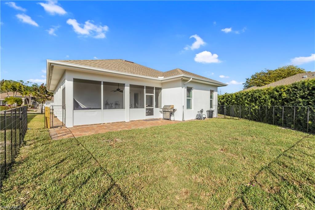 11141 Palmetto Ridge Drive Naples, FL 34110 - Photo 4 of 31 a view of a house with a patio