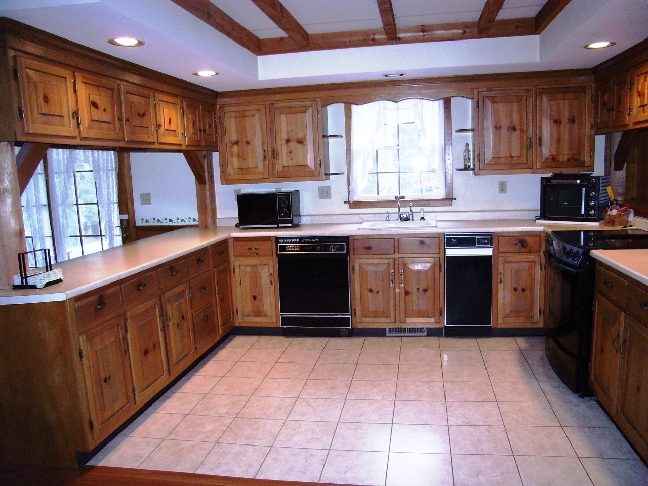 87 County Road Huntington, MA 01050 - Photo 6 of 19 a kitchen with stainless steel appliances granite countertop a sink counter space cabinets a stove and a window
