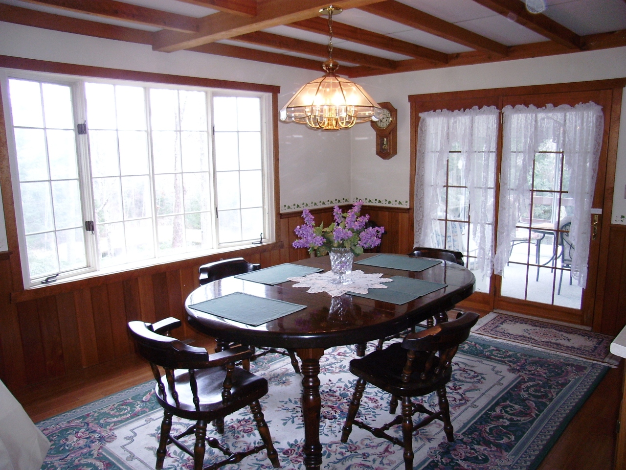87 County Road Huntington, MA 01050 - Photo 7 of 19 a dining room with furniture a chandelier and wooden floor