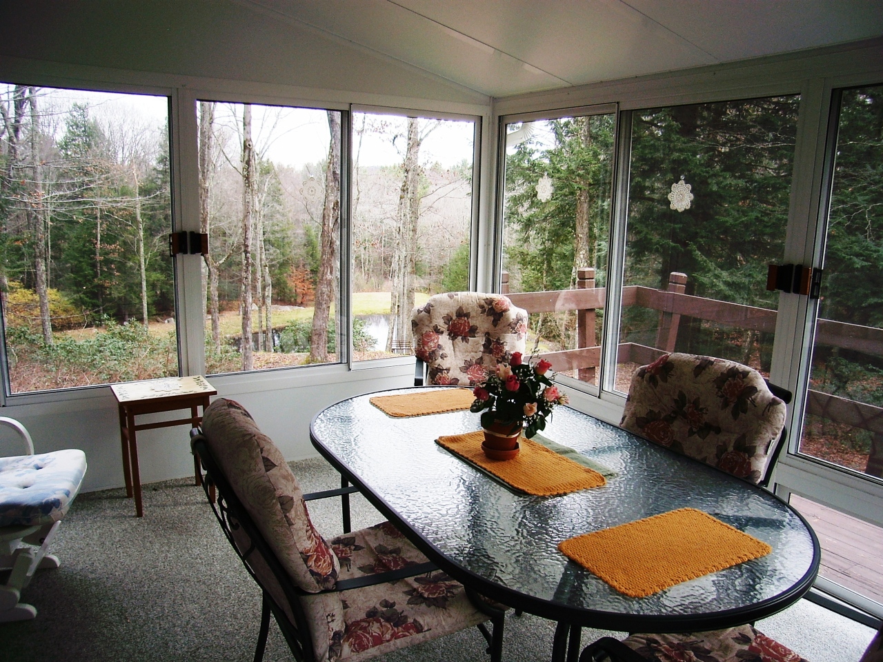 87 County Road Huntington, MA 01050 - Photo 10 of 19 a view of a dining room with furniture wooden floor and a potted plant