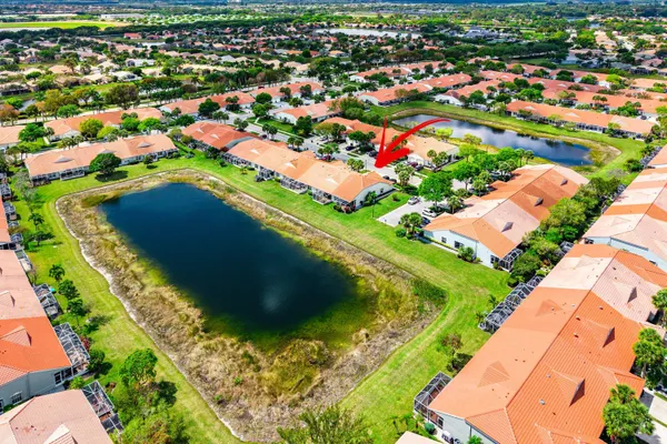a view of a lake with houses in the back