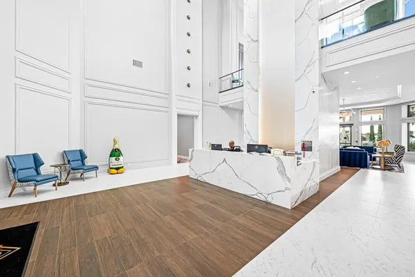 a large kitchen with kitchen island granite countertop a large counter top stainless steel appliances and cabinets