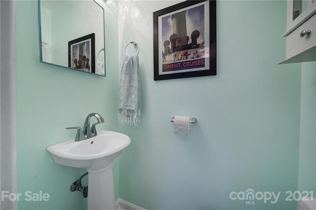 5046 Milford Road Charlotte, NC 28210 - Photo 12 of 32 a bathroom with a sink and mirror