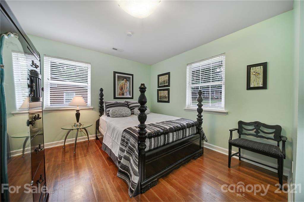 5046 Milford Road Charlotte, NC 28210 - Photo 13 of 32 a bedroom with a bed wooden floor and window