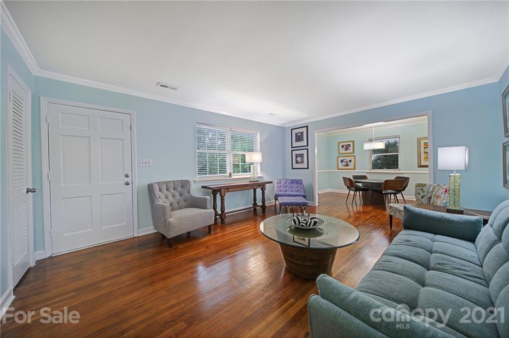 5046 Milford Road Charlotte, NC 28210 - Photo 3 of 32 a living room with furniture a rug a window and a lamp