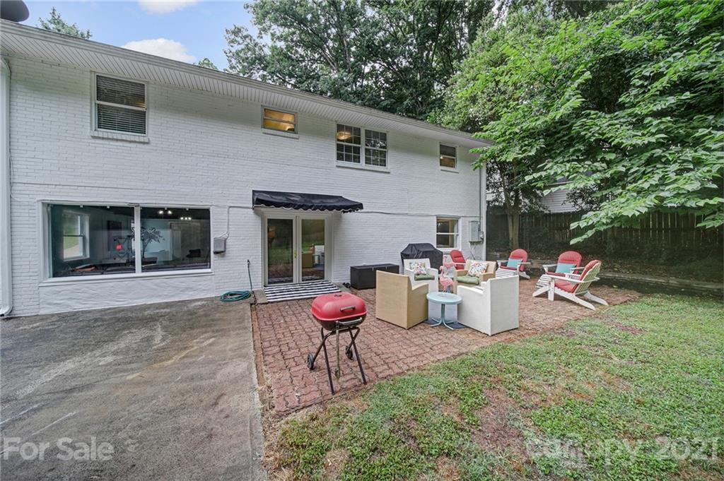 5046 Milford Road Charlotte, NC 28210 - Photo 28 of 32 a view of a chair and table in backyard of the house