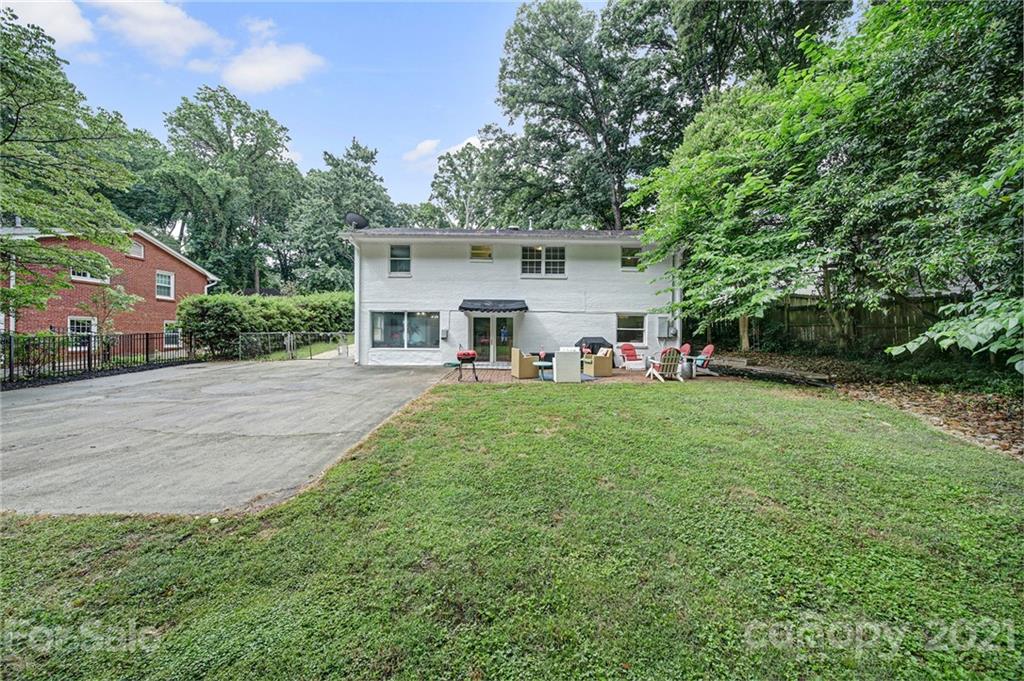 5046 Milford Road Charlotte, NC 28210 - Photo 29 of 32 a view of a house with backyard and a tree