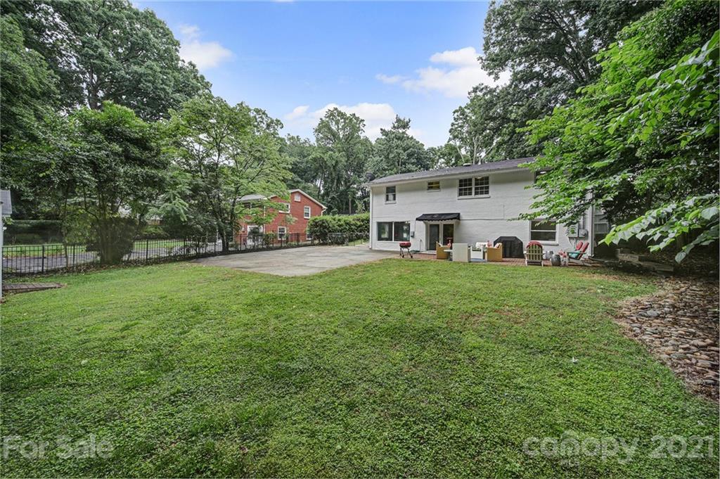 5046 Milford Road Charlotte, NC 28210 - Photo 30 of 32 a view of a house with a big yard and large trees