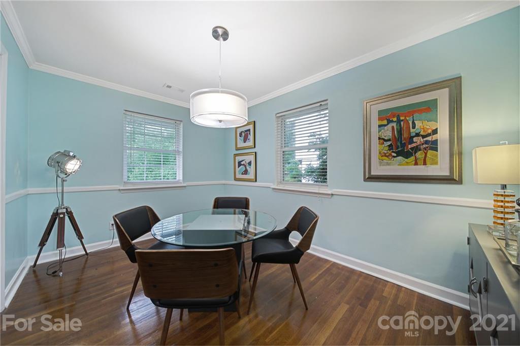 5046 Milford Road Charlotte, NC 28210 - Photo 5 of 32 a view of a dining room with furniture window and wooden floor