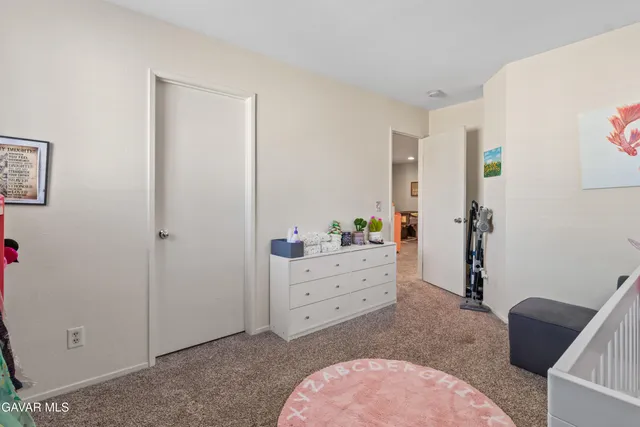 a bed room with a bed and a dresser