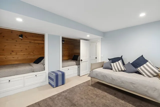 a bedroom with a bed and couch