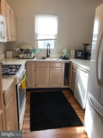a kitchen with sink cabinets and window