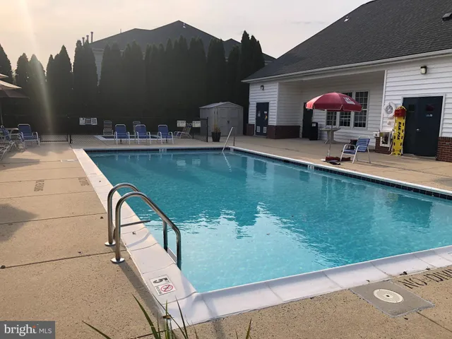 a view of a swimming pool with a deck