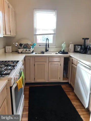 a kitchen with sink and window