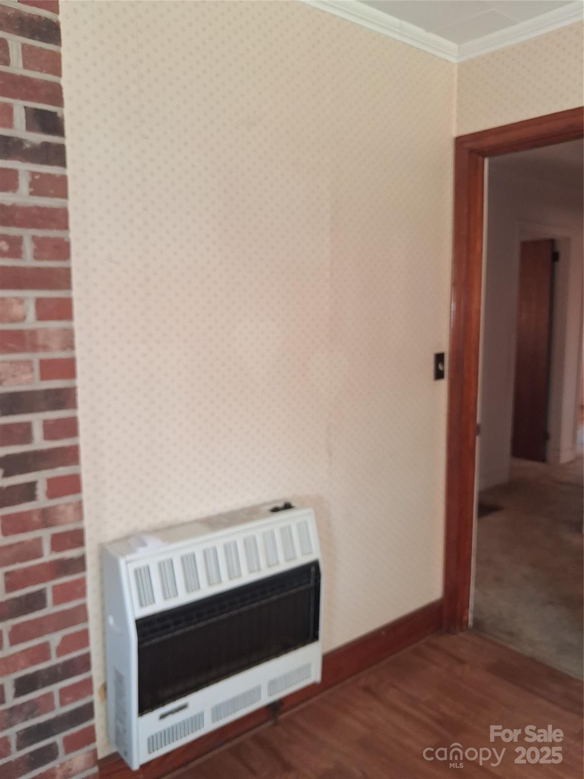 2833 Camp Creek Church Road Mooresboro, NC 28114 - Photo 25 of 43 a view of an empty room with wooden floor and a fireplace