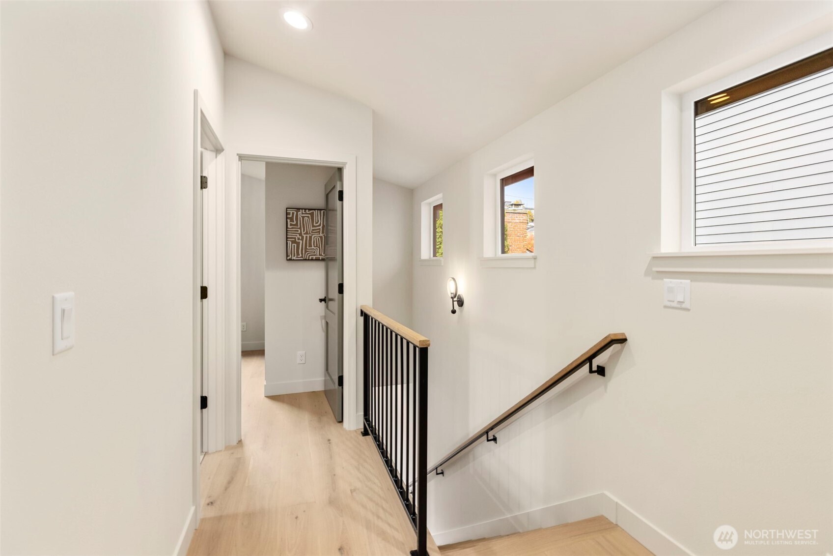3404 33rd Avenue West Seattle, WA 98199 - Photo 17 of 29 a view of a hallway with entryway with wooden floor