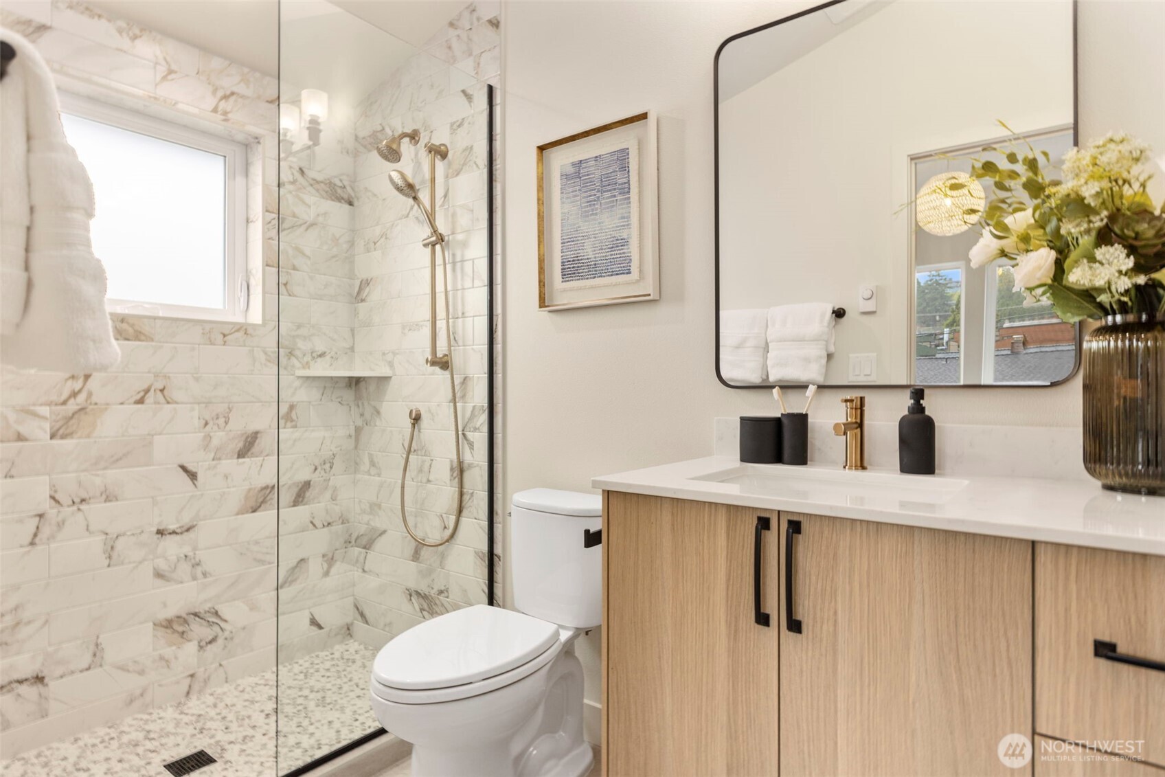 3404 33rd Avenue West Seattle, WA 98199 - Photo 22 of 29 a bathroom with a granite countertop sink a toilet and shower