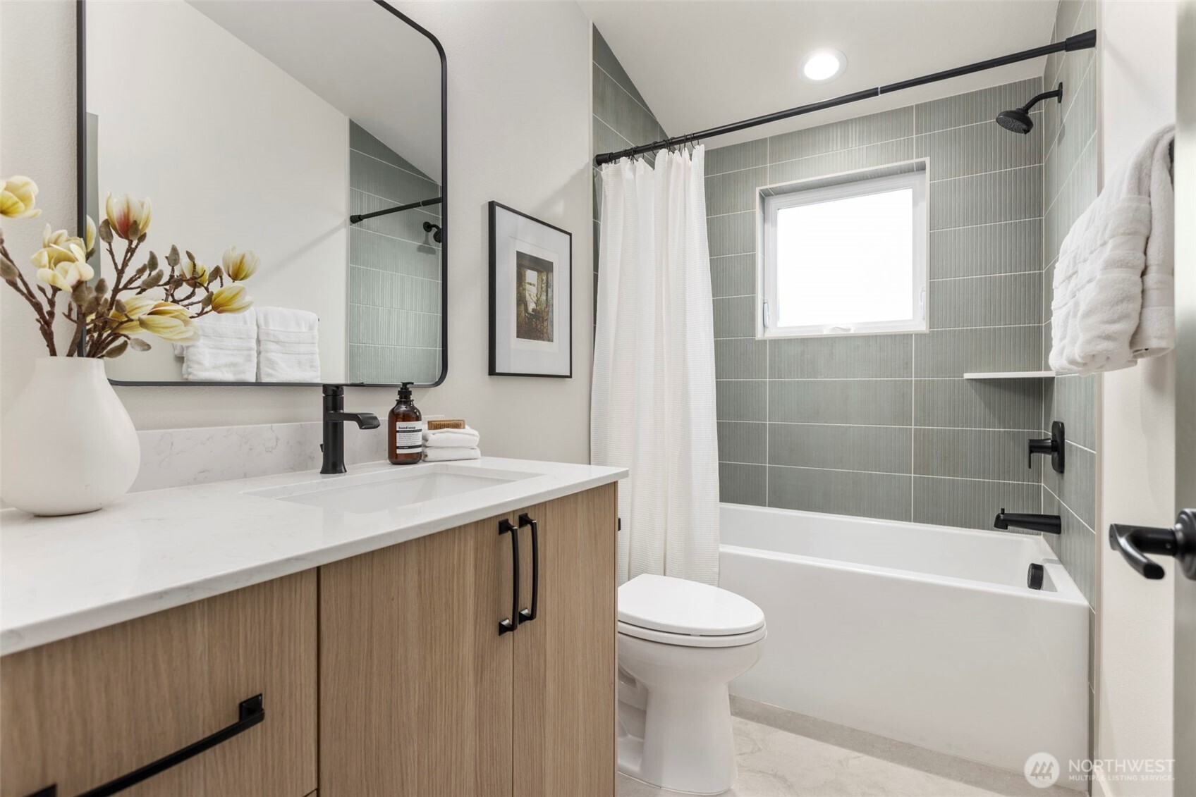 3404 33rd Avenue West Seattle, WA 98199 - Photo 26 of 29 a bathroom with a sink a toilet and a bathtub