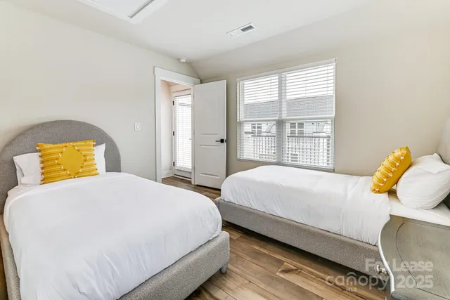 a bedroom with bed and window