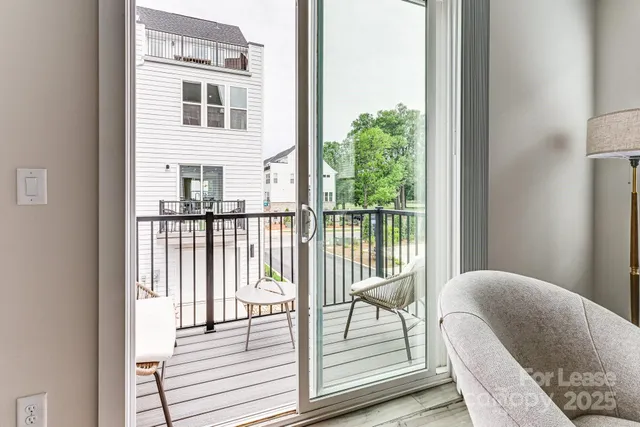 a balcony view with a glass door