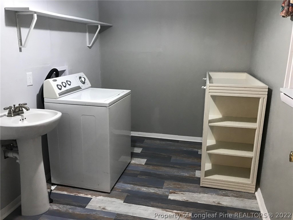 1602 Crescent Drive Spring Lake, NC 28390 - Photo 7 of 12 a utility room with dryer and washer