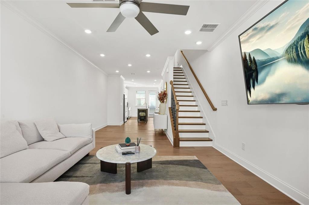 3927 Allegretto Circle Atlanta, GA 30339 - Photo 13 of 54 a living room with furniture and a wooden floor