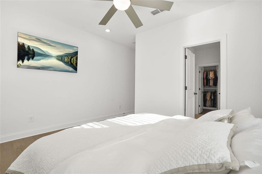 3927 Allegretto Circle Atlanta, GA 30339 - Photo 17 of 54 a bedroom with a bed and a painting on the wall