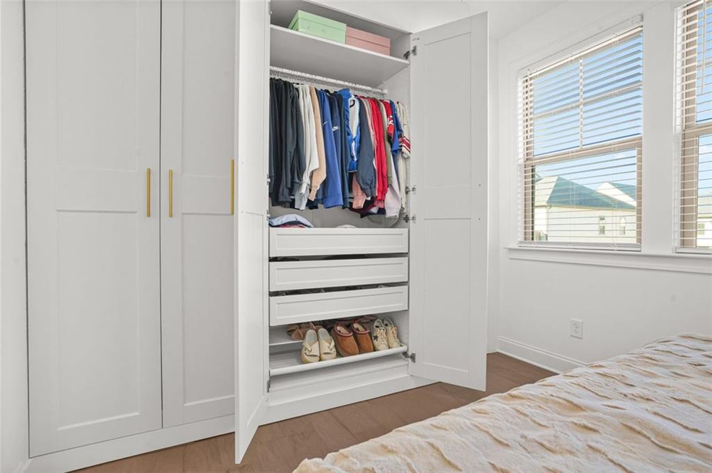 3927 Allegretto Circle Atlanta, GA 30339 - Photo 27 of 54 a view of a bedroom with wooden floor and window