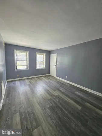 a kitchen with stainless steel appliances granite countertop a refrigerator a stove a sink and a microwave