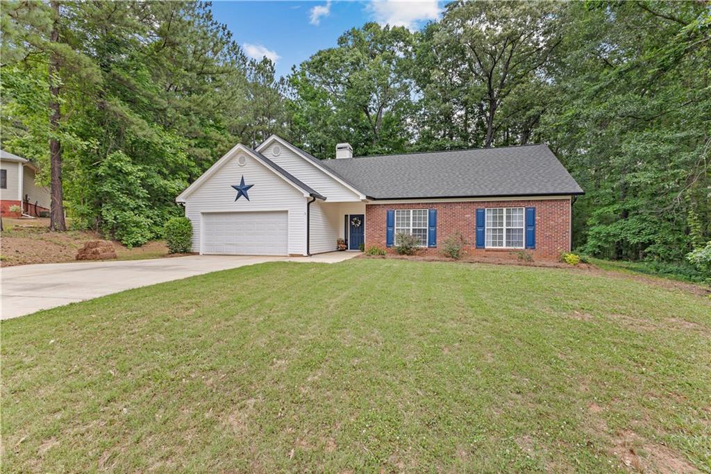 480 S Ridge Senoia, GA 30276 - Photo 1 of 1 a front view of a house with a garden