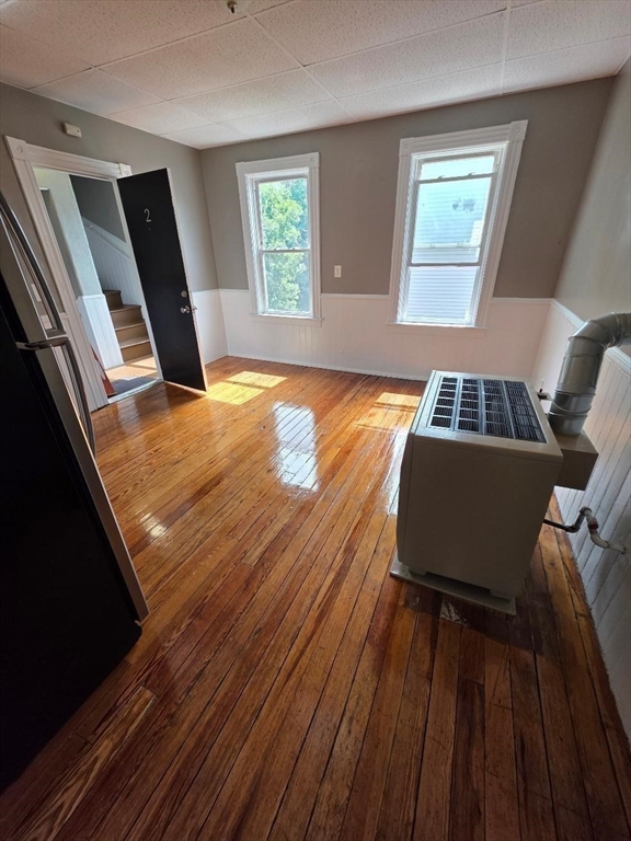 762 Globe Street, Unit 2 Fall River, MA 02724 - Photo 13 of 20 a living room with wooden floor and a window