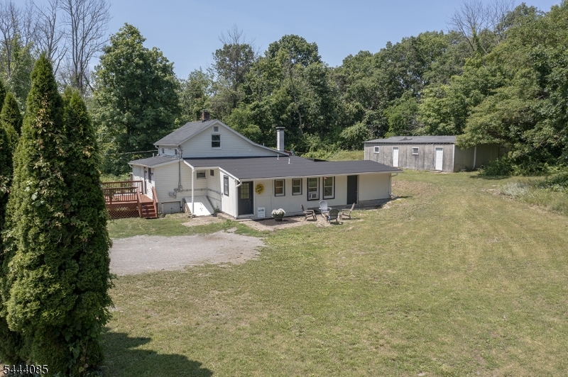 79 Lake Wallkill Road Vernon, NJ 07461 - Photo 23 of 27 a front view of a house with yard and green space