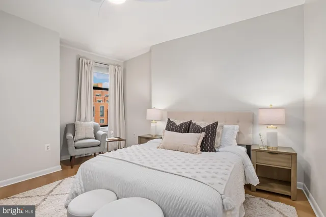 a bedroom with a bed and lamp