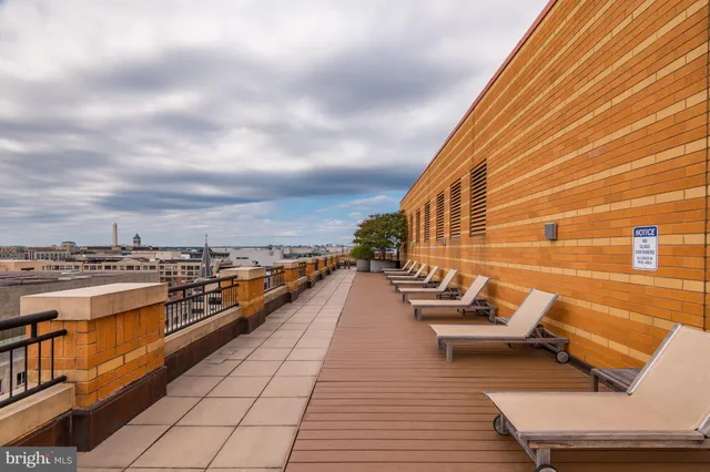 a view of swimming pool with seating space