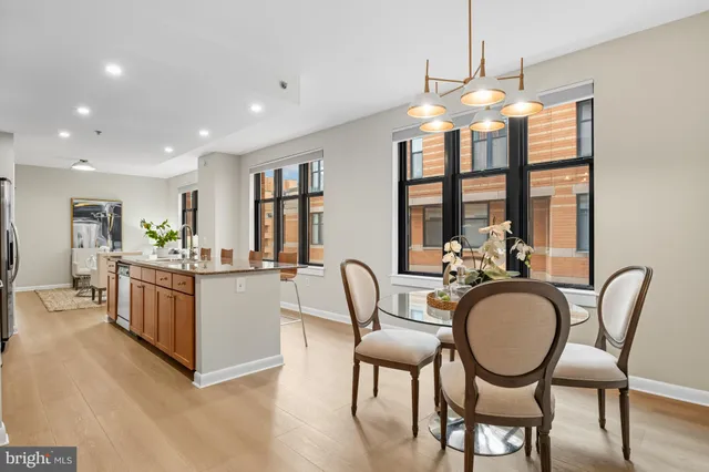 a kitchen with dining table and chairs