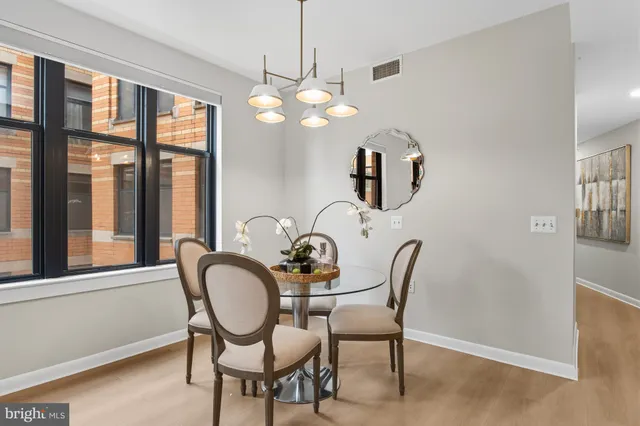 a dining room with furniture and window