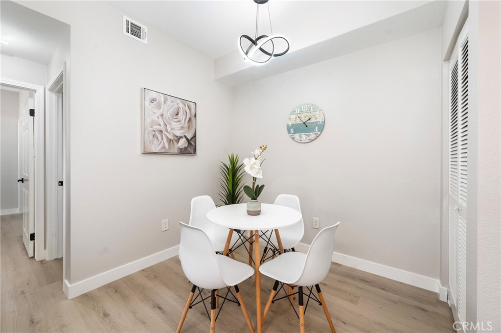 375 Central Avenue, Unit 151 Riverside, CA 92507 - Photo 9 of 52 a view of a dining room with furniture and wooden floor