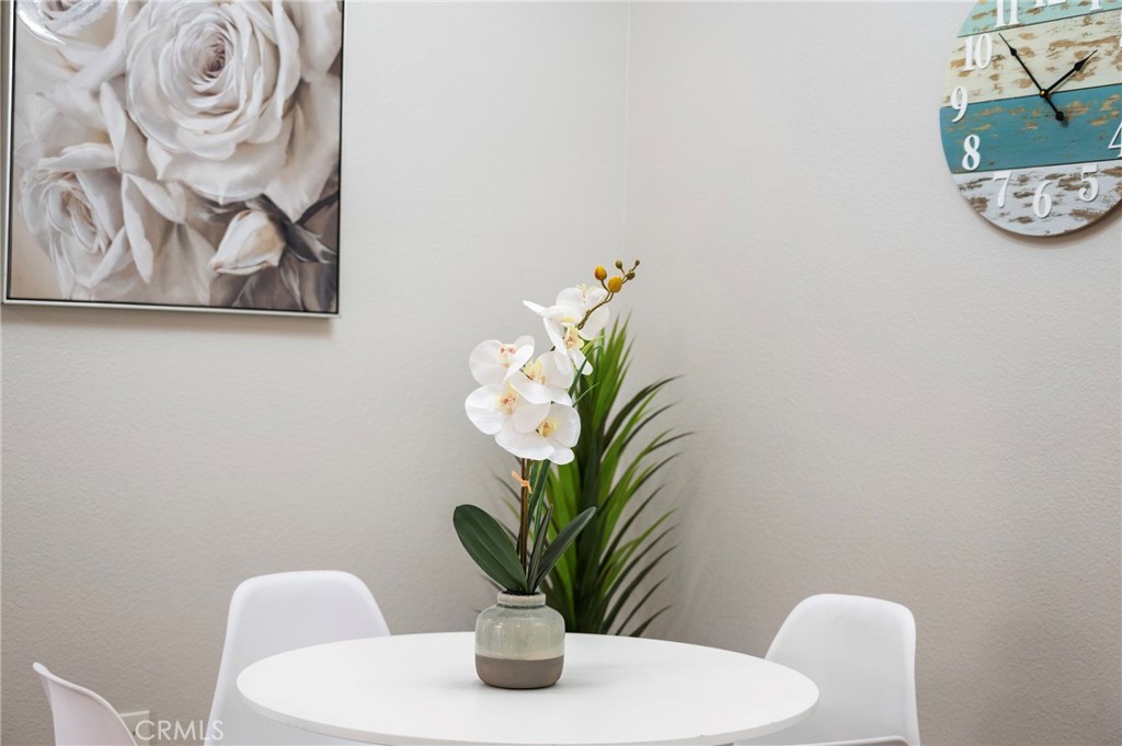 375 Central Avenue, Unit 151 Riverside, CA 92507 - Photo 10 of 52 a view of a dining room with furniture and a potted plant